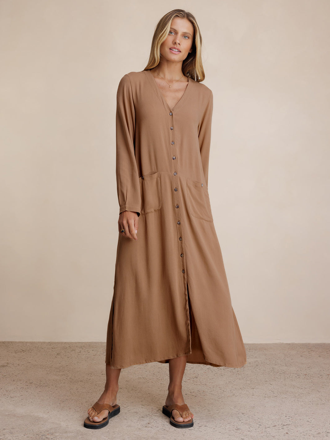 Model wears Evita Ecovero Midi Shirt Dress in Desert Sand