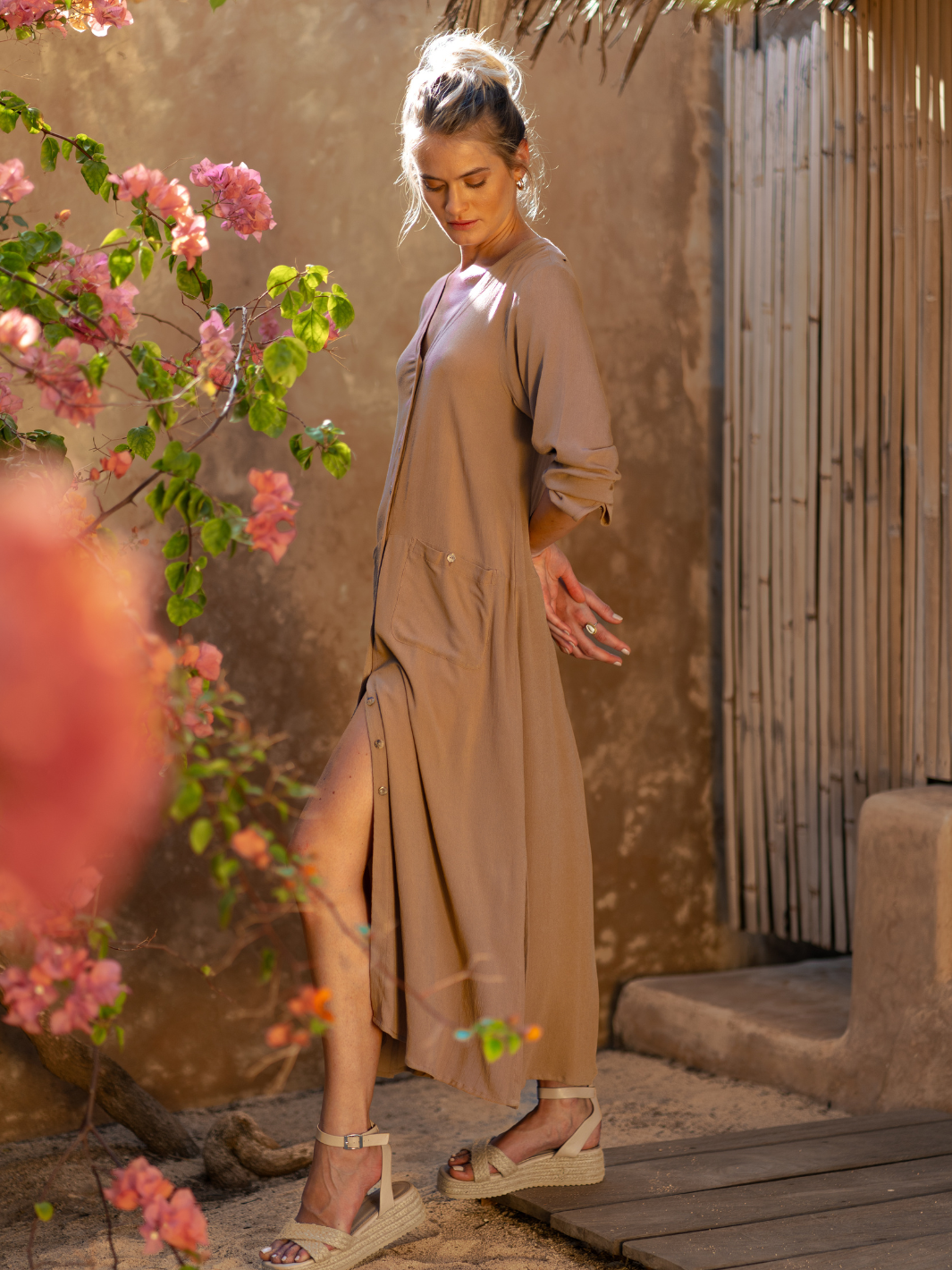 Model wears Evita Ecovero Midi Shirt Dress in Desert Sand