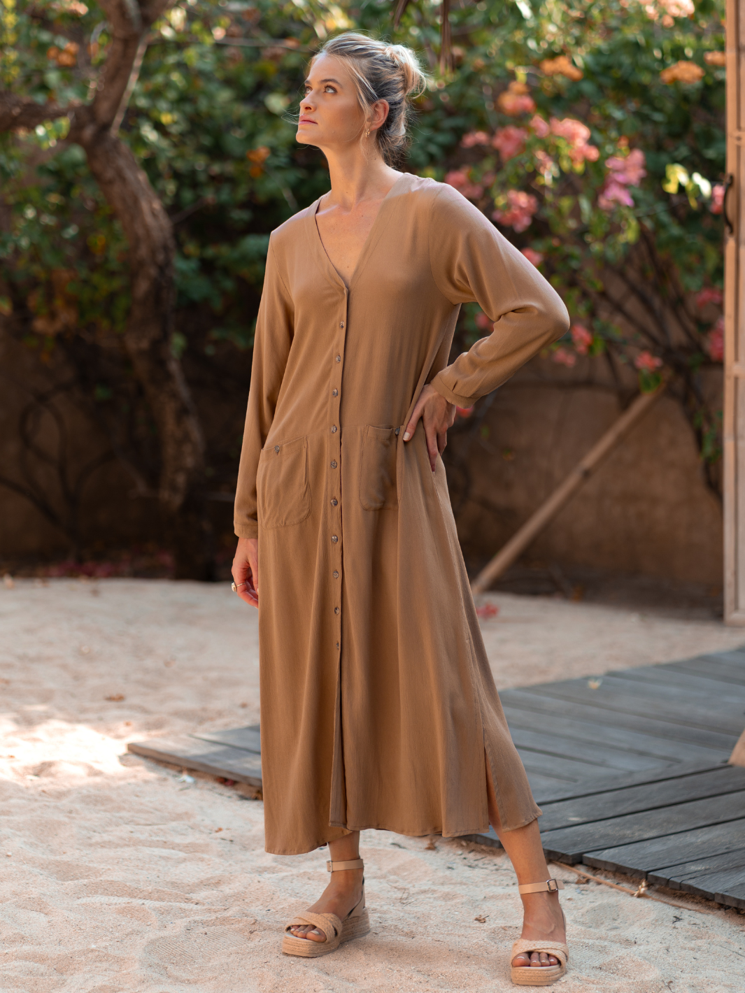 Model wears Evita Ecovero Midi Shirt Dress in Desert Sand