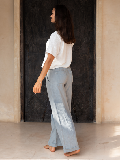 Model wears Sancia Cotton Pants in Slate Blue