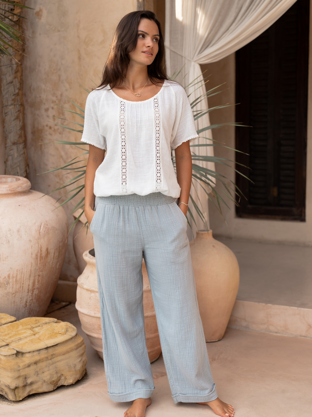 Model wears Sancia Cotton Pants in Slate Blue