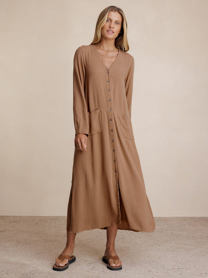 Model wears Evita Ecovero Midi Shirt Dress in Desert Sand