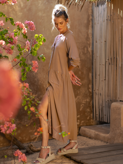 Model wears Evita Ecovero Midi Shirt Dress in Desert Sand