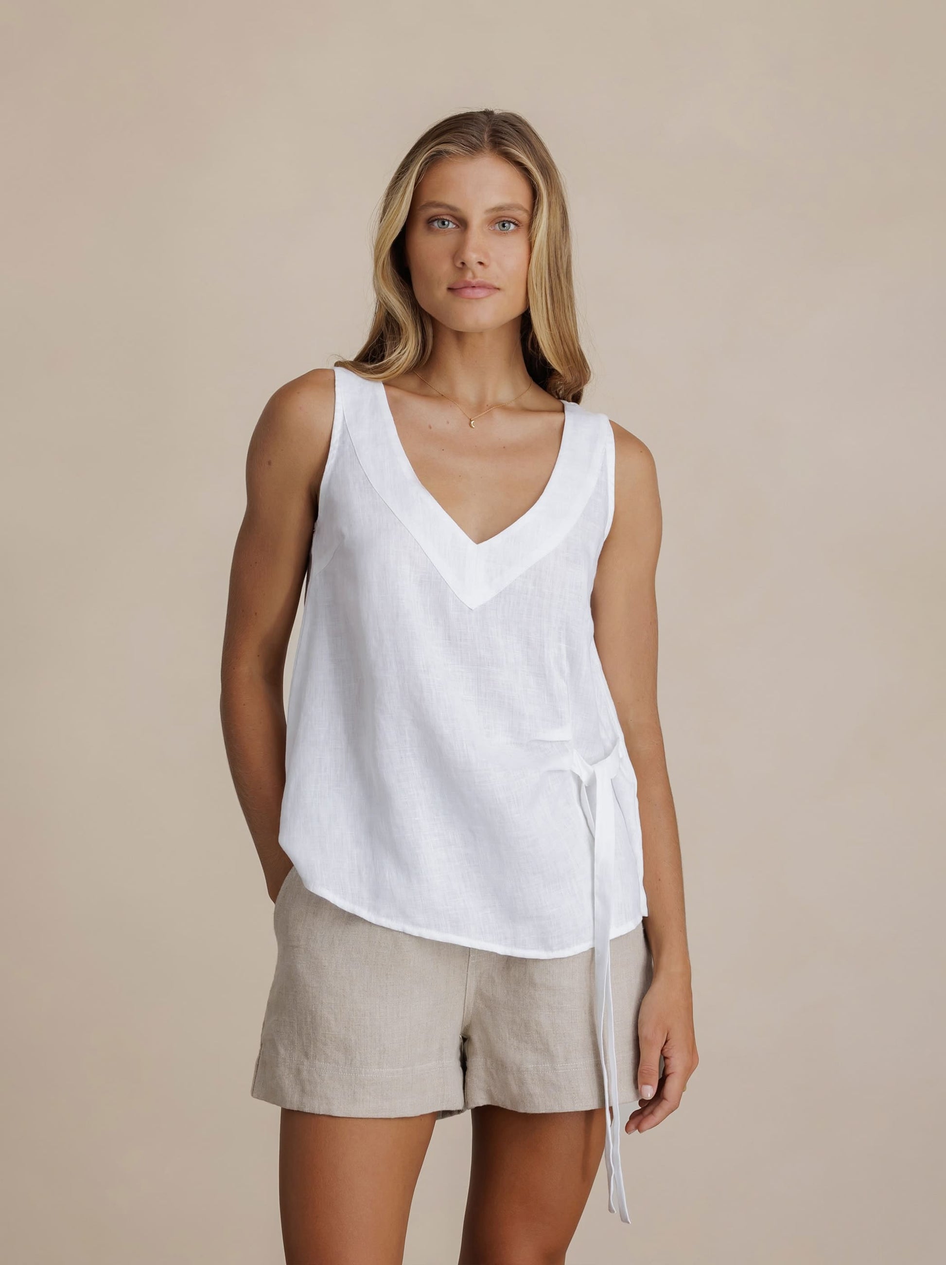 Model wears Mandalay Linen Top in White