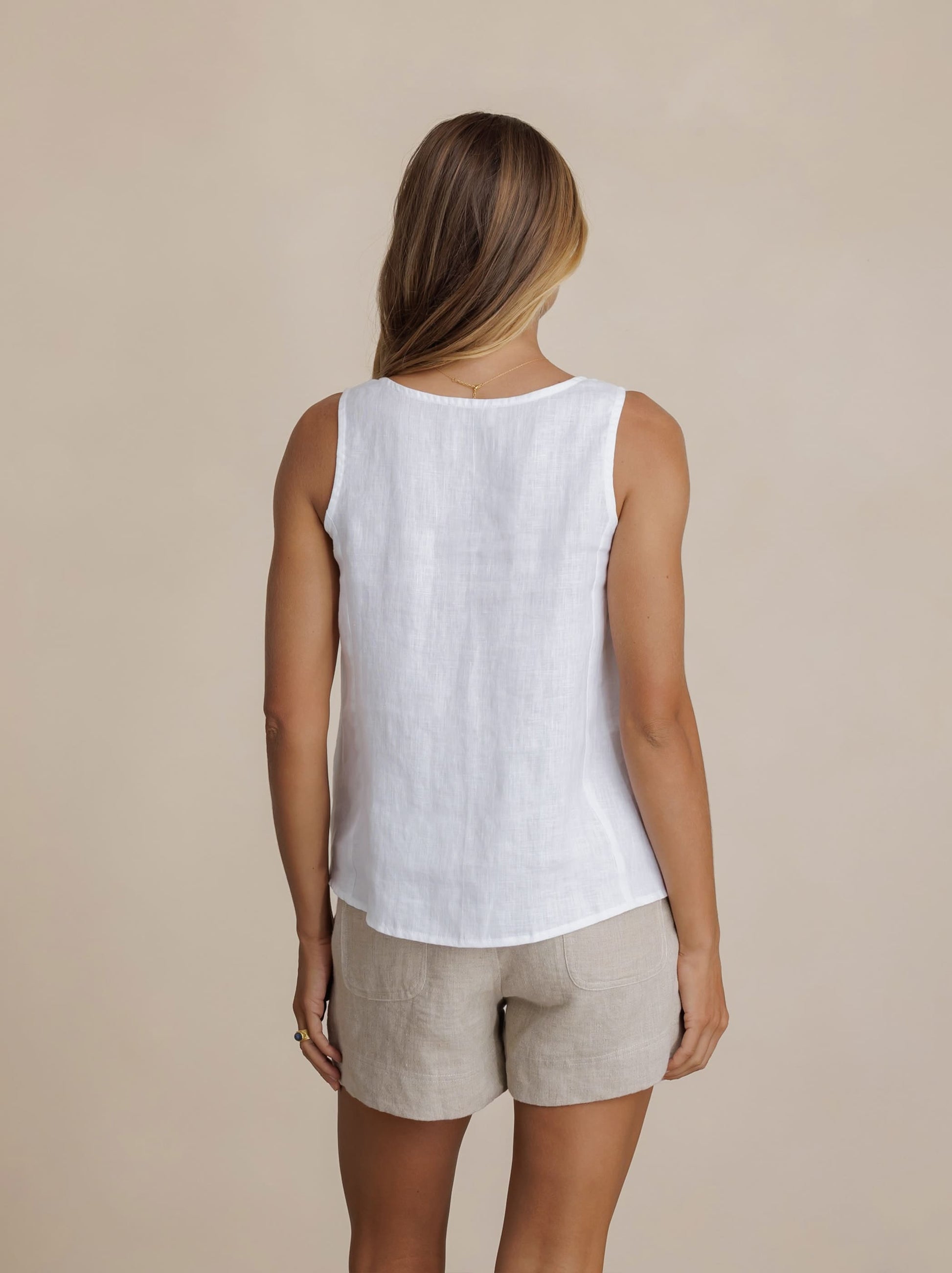 Model wears Mandalay Linen Top in White