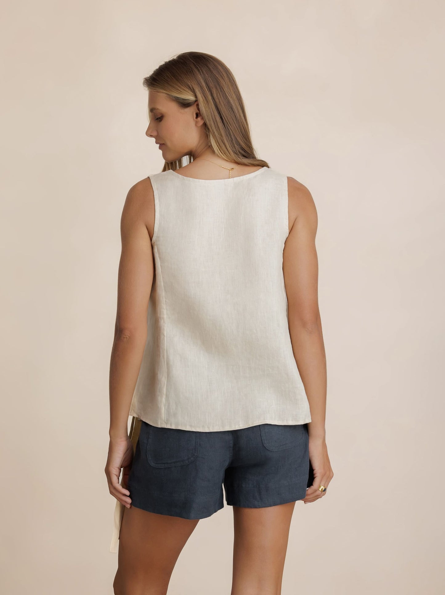 Model wears Mandalay Linen Top in Stone