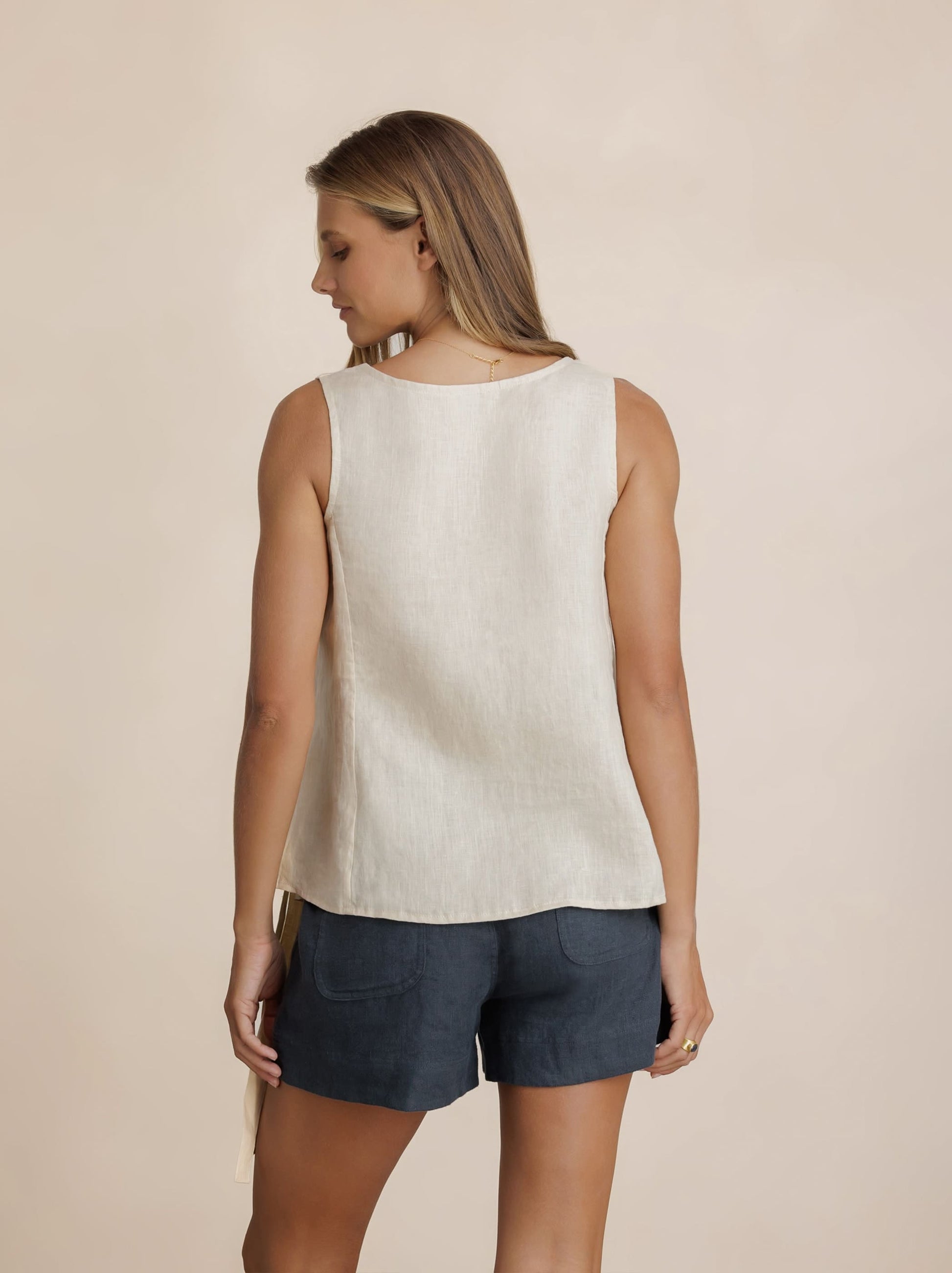 Model wears Mandalay Linen Top in Stone