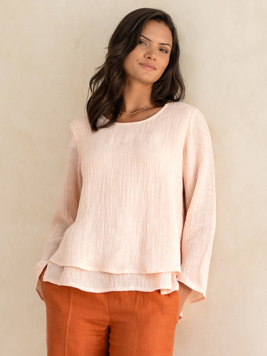 Model wears Viola Linen Top in Coral