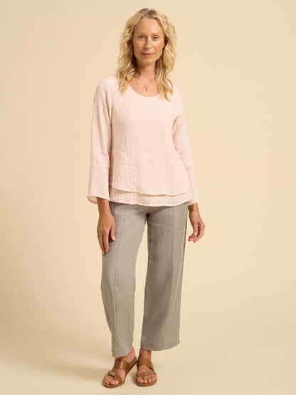 Model wears Viola Linen Top in Coral