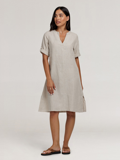 Model wears Elyse French Linen Midi Dress in Flax