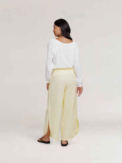 Model wears Sienna Linen Pants in Lemon